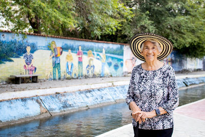 Senior woman tourist at the macondo linear park in aracataca the birthplace of  garcia marquez