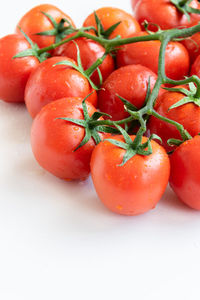 High angle view of wet tomatoes in container