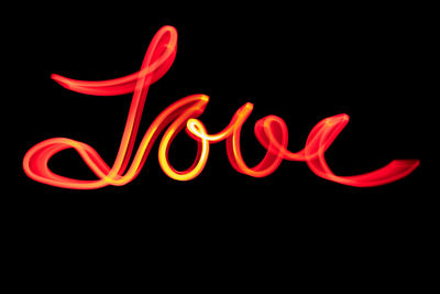 Close-up of illuminated text against black background