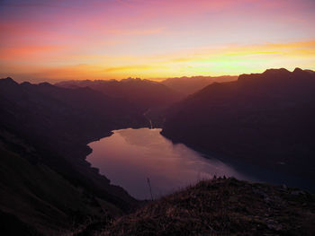 Scenic view of mountains against sky during sunset