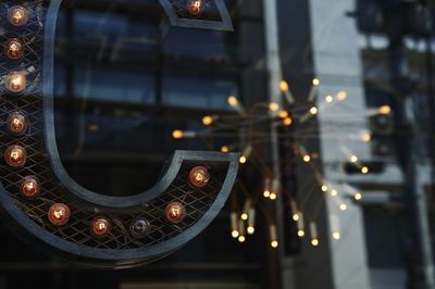 Close-up of light bulbs on metallic structure