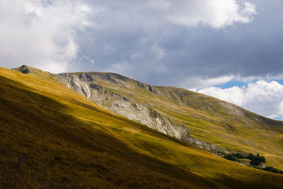 Scenic view of landscape against sky in bolognola, marche italy