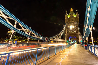 Illuminated bridge at night