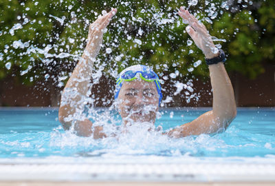 Portrait of man in swimming pool