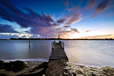 Scenic view of sea against sky at sunset