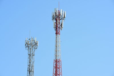 Low angle view of communications tower against sky