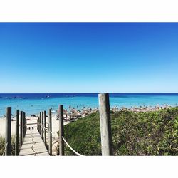 Scenic view of sea against clear blue sky