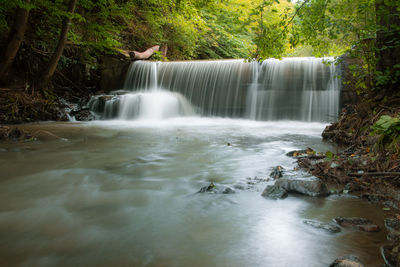 High angle view of waterfall in forest