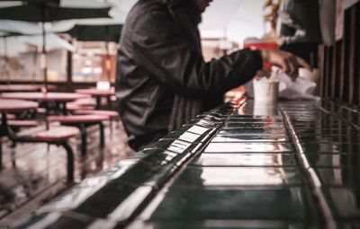 Side view of man standing in snow