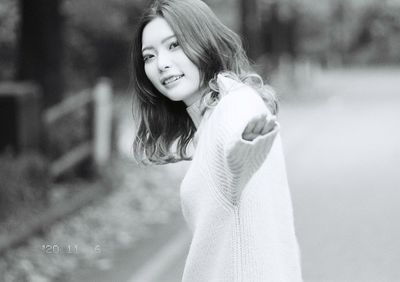 Portrait of smiling girl standing outdoors