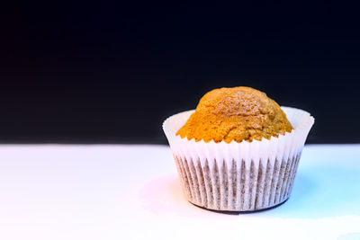 Close-up of chocolate cake against black background