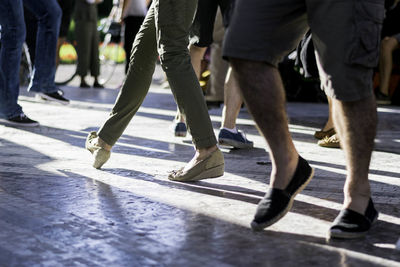 Low section of men on zebra crossing