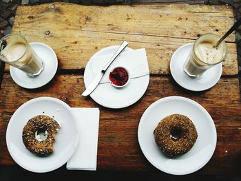 Directly above shot of bagels and iced coffees on table