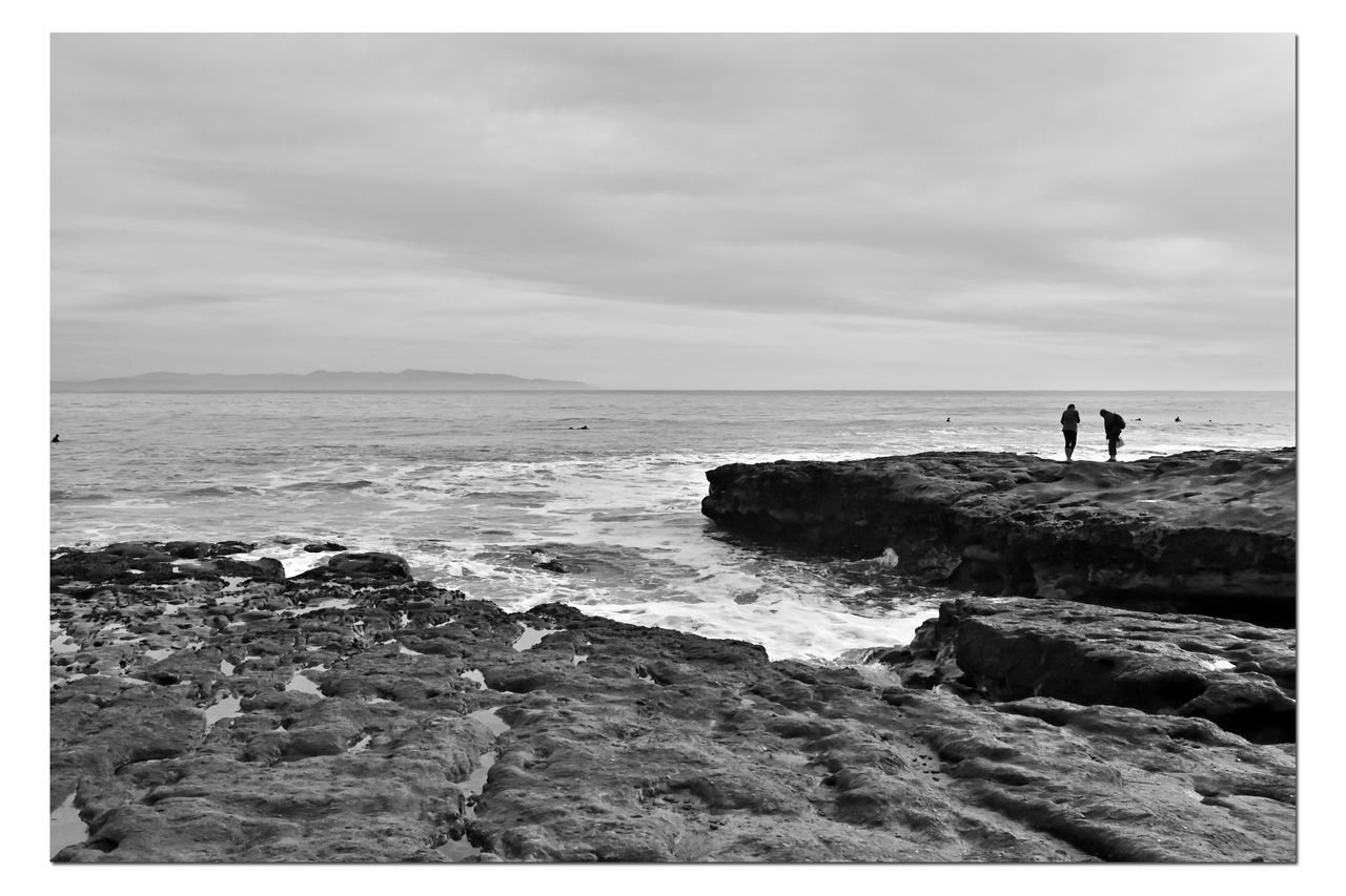 SCENIC VIEW OF SEA AND ROCKS AGAINST SKY