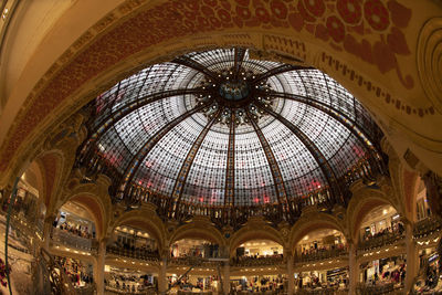 Low angle view of illuminated ceiling in shopping mall