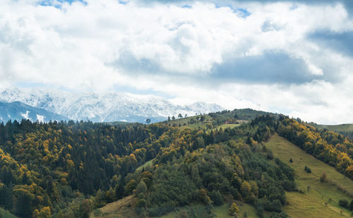 Scenic view of tree mountains against sky