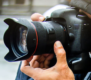 Close-up of hand holding camera