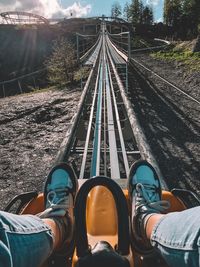 Low section of person on amusement park ride