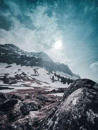 Scenic view of snowcapped mountains against sky