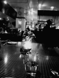 Close-up of lit candles on table in restaurant