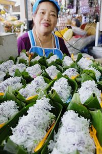 Portrait of a smiling woman in market