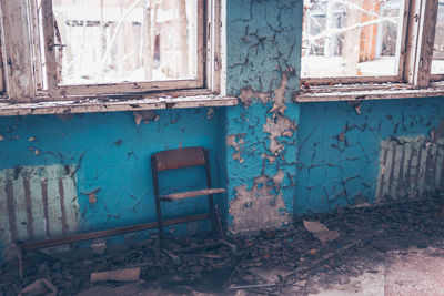 Damaged window of abandoned house