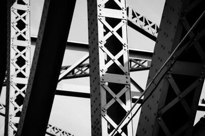 Low angle view of metallic bridge against sky