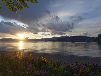 Scenic view of lake against sky during sunset