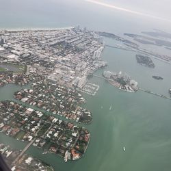 High angle view of buildings by sea