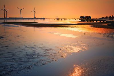 Scenic view of beach at sunset