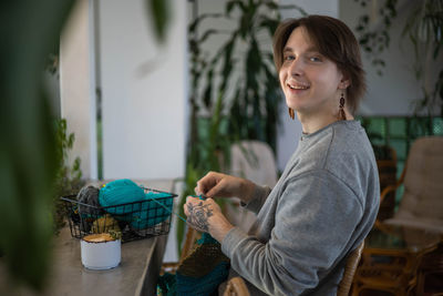 Portrait of young woman using mobile phone