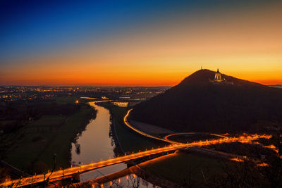 Aerial view of cityscape against sky during sunset