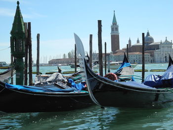 Boats moored at harbor