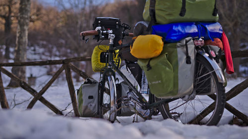 Man cycling on snow covered field