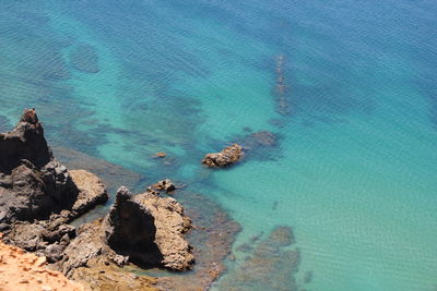 High angle view of rock formation in sea