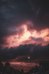 Low angle view of dramatic sky during sunset