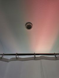 Low angle view of electric light on wall