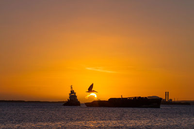 Scenic view of sea at sunset