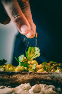 Close-up of man preparing food