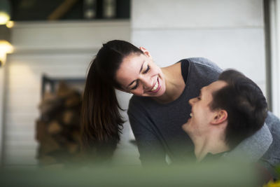 Young couple in a living room in love