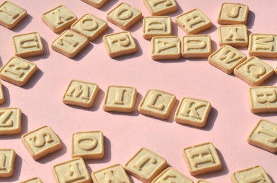 High angle view of biscuits with milk text on table