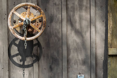 Close-up of rusty hanging on wall