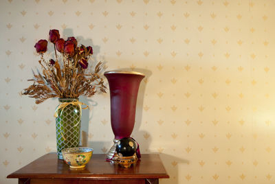 Flower vase on table at home