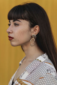 Portrait of young woman looking away