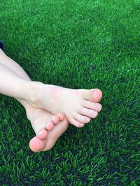 Low section of woman on grass