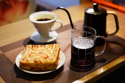 Close-up of coffee and cup on table