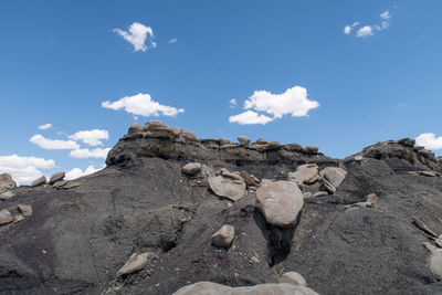 Low angle view of rocks against sky