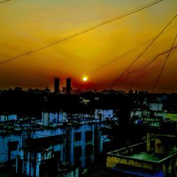 Silhouette of city during sunset