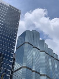 Low angle view of modern buildings against sky