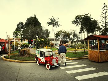 People walking on road in city